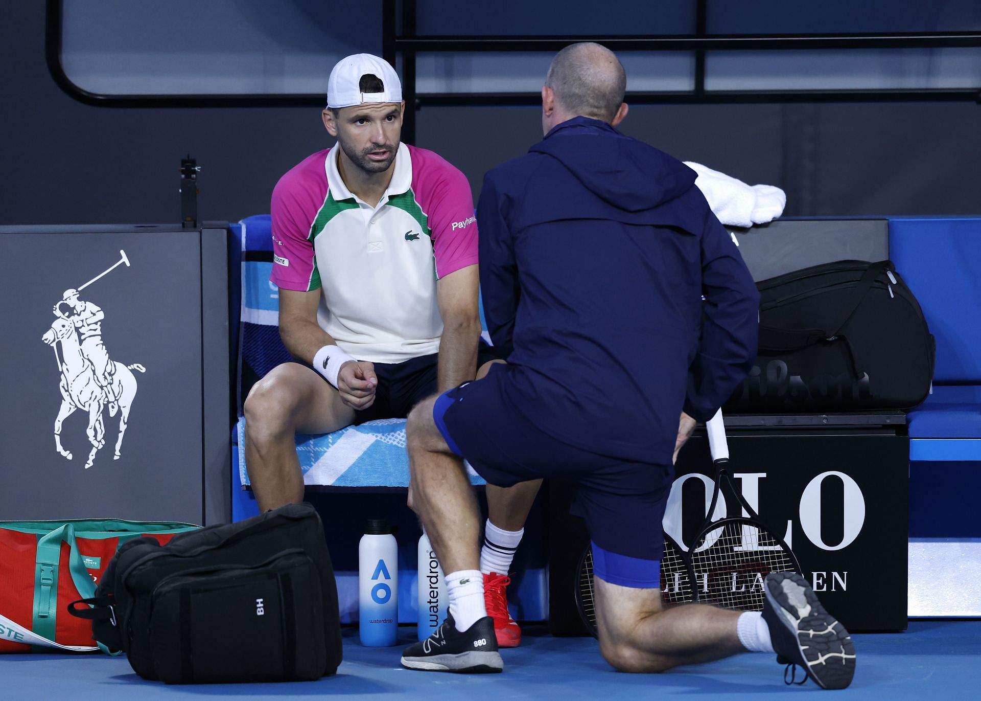 Grigor Dimitrov talks to the physio before retirement at Australian Open | Image Source: Getty